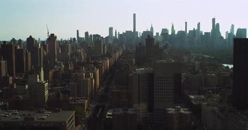 New York City central park aerial view of trains and skyscrapers on a sunny day