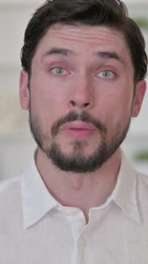 Adult Man Talking and Pointing at the Camera
