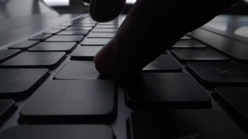 A Program Coder is Typing on Laptop Keyboard Close Up Macro Hacker is Using Computer Man Hands are