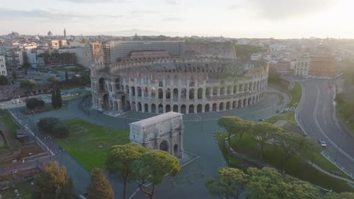 Aerial view towards the Colosseum, quiet morning in Rome, Italy - approaching, drone shot