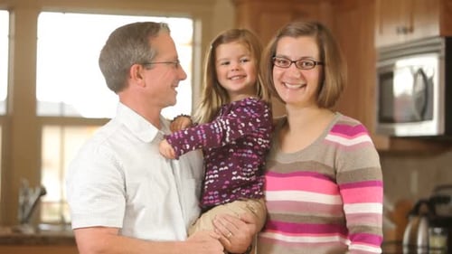 Smiling Family Portrait in Home Kitchen