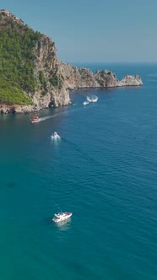 Scenic Coastline and Boats on Turquoise Water