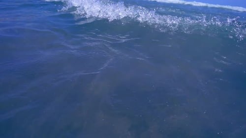 Ocean Foam Waves on Beach. Top View of Small Waves Reaching Seashore