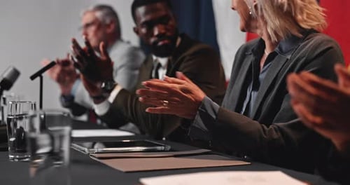 People Clapping at a Business Conference in France