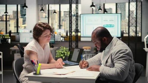 Business Colleagues Meeting Discussing Documents in Modern Office