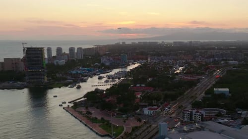 Drone Shot Over Puerto Vallarta City With Marina And Cruise Port At Sunset In Mexico