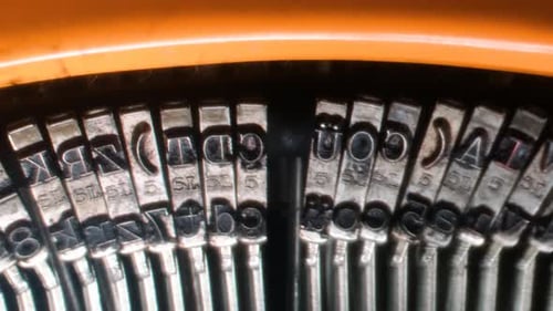 Writing letters with orange retro vintage typewriter