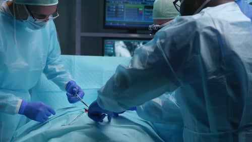 Team of Professional Medical Surgeons Performs the Surgical Operation in a Modern Hospital Doctors
