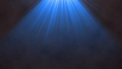 Shining Blue Light Rays with Atmospheric Smoke Overlay