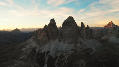 The Sun Descends Casting Golden Light on Rocky Mountains Tre Cime Di Lavaredo