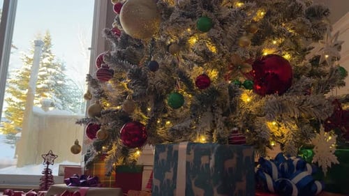 Presents under a decorated Christmas tree indoors
