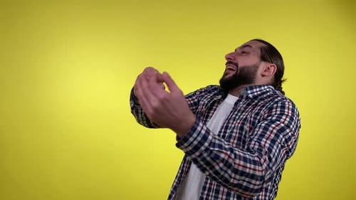 Portrait Expressive Man Gesturing Scolding Isolated on Yellow Indoors