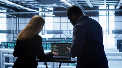 IT Support Staff Members in Server Hub Monitoring Server Infrastructure