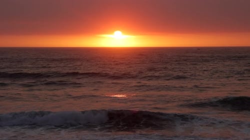 Beautiful colorful sunset with the sun about to go down in the Pacific Ocean