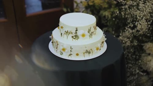Elegant Wedding Cake with Flowers on Display