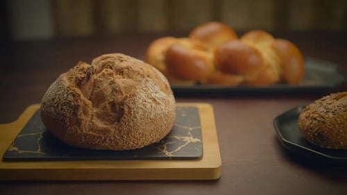 Fresh Bread Loaves on a Wood Table