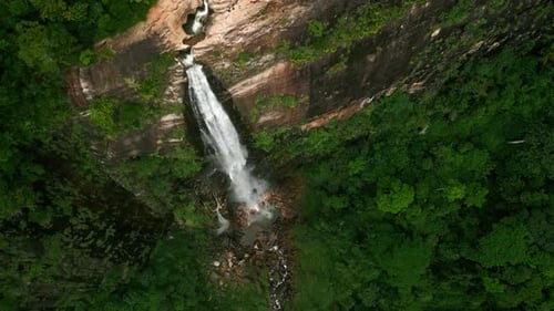 Aerial Drone Diyaluma Falls As Water Cascades Down Amid Green Plants in Sri Lanka Mountains Hidden