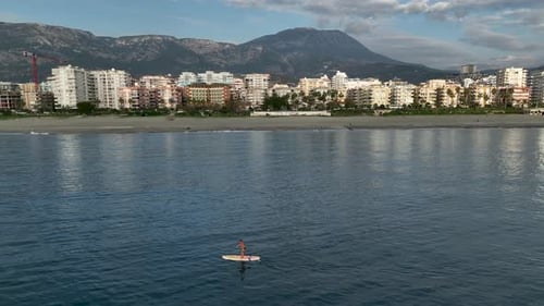 Sea Man Sup Top Down View on Athlete Man Swimming in Sea and Paddleboarding at Summer Sunset