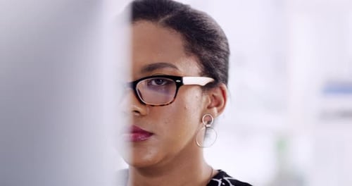 4k video footage of a well dressed corporate businesswoman working on her computer in the office