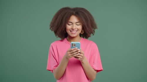 Pretty Woman Surfing Internet On Smartphone Girl With Smile On Green Background