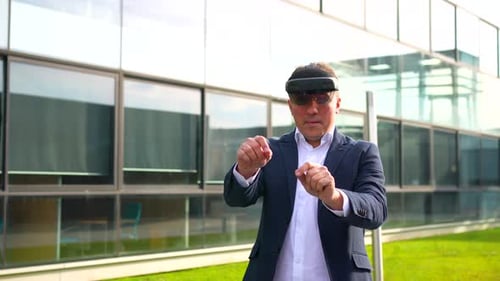 Man Controls Virtual Screen with Augmented Reality Headset