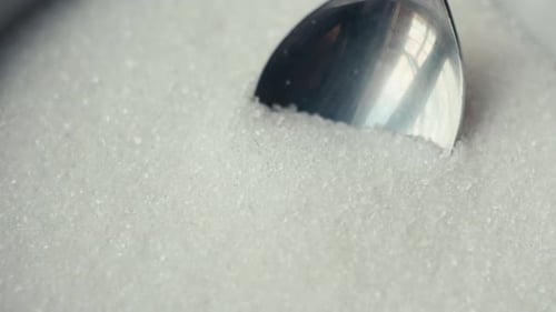 Spoon Scooping White Granulated Sugar Close-up