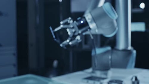 Robot Arm Holding Green Mock-up Screen Smartphone in Landscape Mode, Smoothly Moving into Focus. In