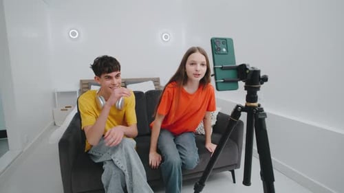 Teen Friends Record Video on Phone in Bedroom