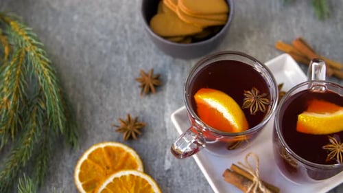 Christmas and Seasonal Drinks Concept - Glasses of Hot Mulled Wine With