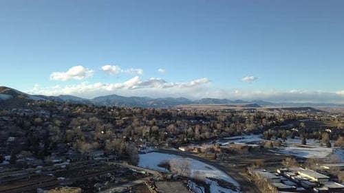 A pan over Lakewood Colorado capturing Golden and the Rocky Mountains