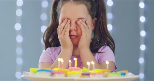 Excited Girl Surprised with Birthday Cupcakes