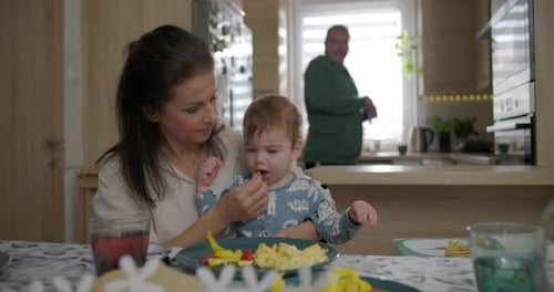 Mother and Child Enjoying Breakfast in Bright Kitchen
