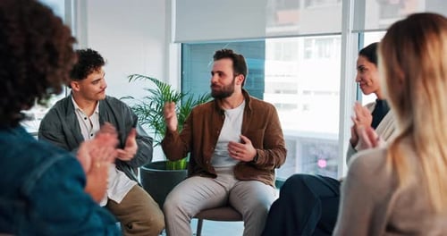 Adults Clapping in a Circle During a Meeting