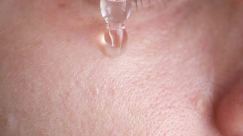 Serum Applied to Face With Dropper, Close Up