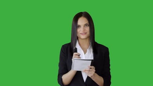Attractive Young Businesswoman Standing Against Green Screen Background