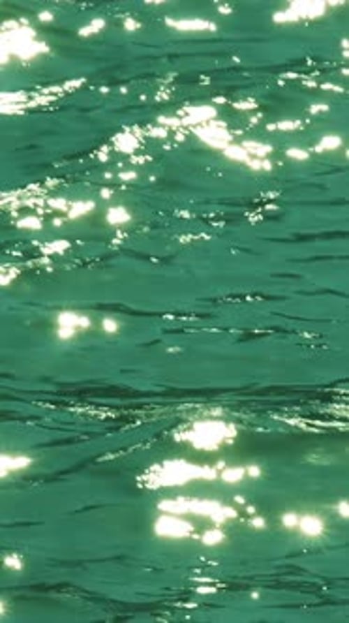 The sea's surface glittered with sparks.