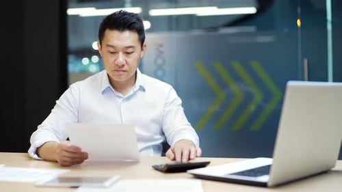 Busy employee, accountant booker working in office workplace counting profit taxes paperwork routine