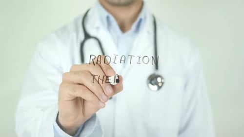 Doctor Writes Radiation Therapy with Marker