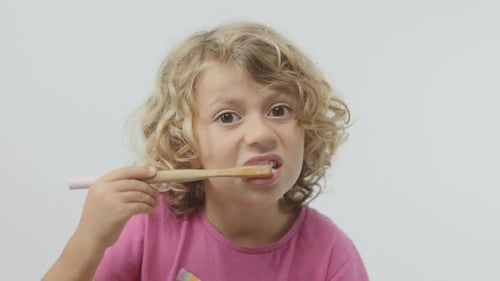 Small Girl Brushing Her Teeth