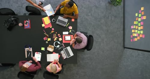 Diverse Team Brainstorming in a Modern Office