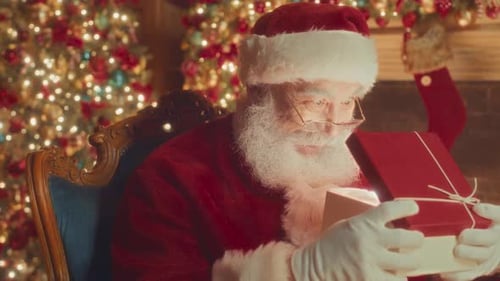 Santa Opening Gift With Christmas Tree Lights