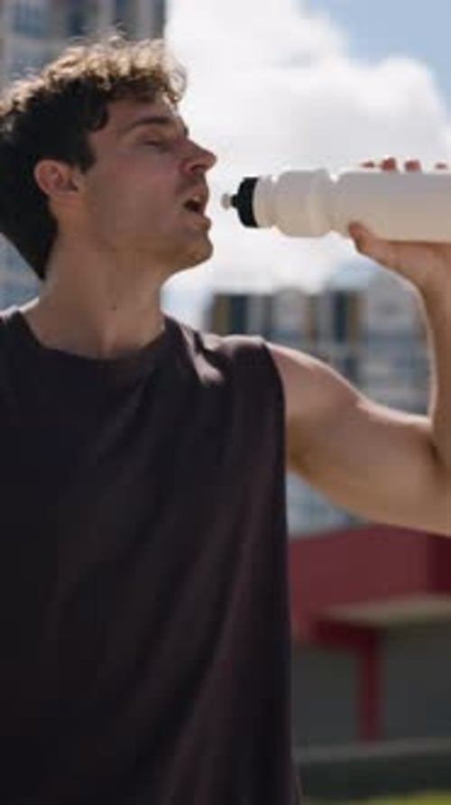 Tired Strong Sport Caucasian Man Drinking Water Holding Bottle Drink Protein Aqua in City Athlete