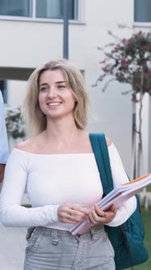Joyful Student Strolling Through Campus on a Sunny Day