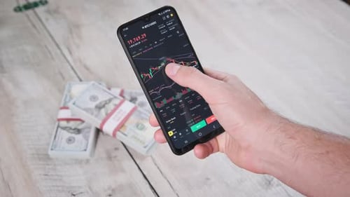 Crypto Trading in Smartphone Bitcoin Graph of Price on Stock Exchange