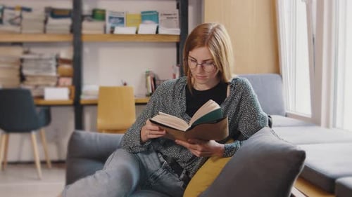 Full Body Young Smiling Happy Smart College Student Girl Wear Green Casual Clothes Sit in Chair