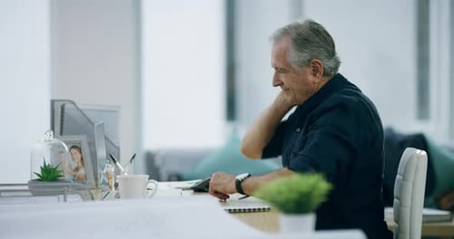 4k video footage of a senior businessman experiencing neck pain while working in the office