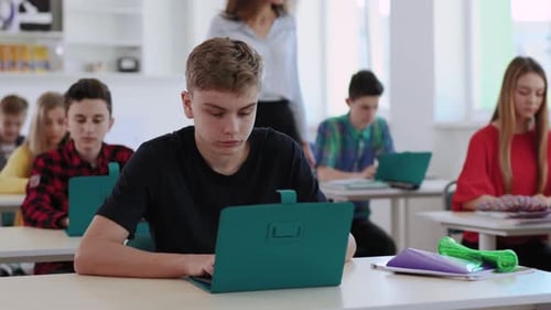 Students Working on Laptops in a Classroom