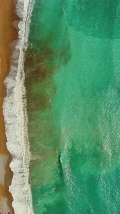 Beach and sea waves top vew