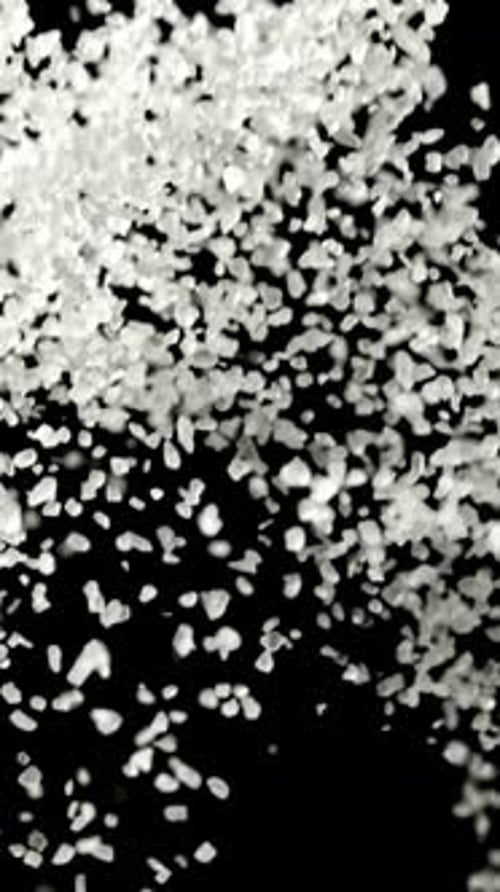 Salt Flies Up on a Black Background Filmed on a Highspeed Camera at 1000 Fps