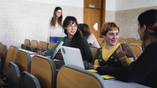 Young people studying in library - School education concept